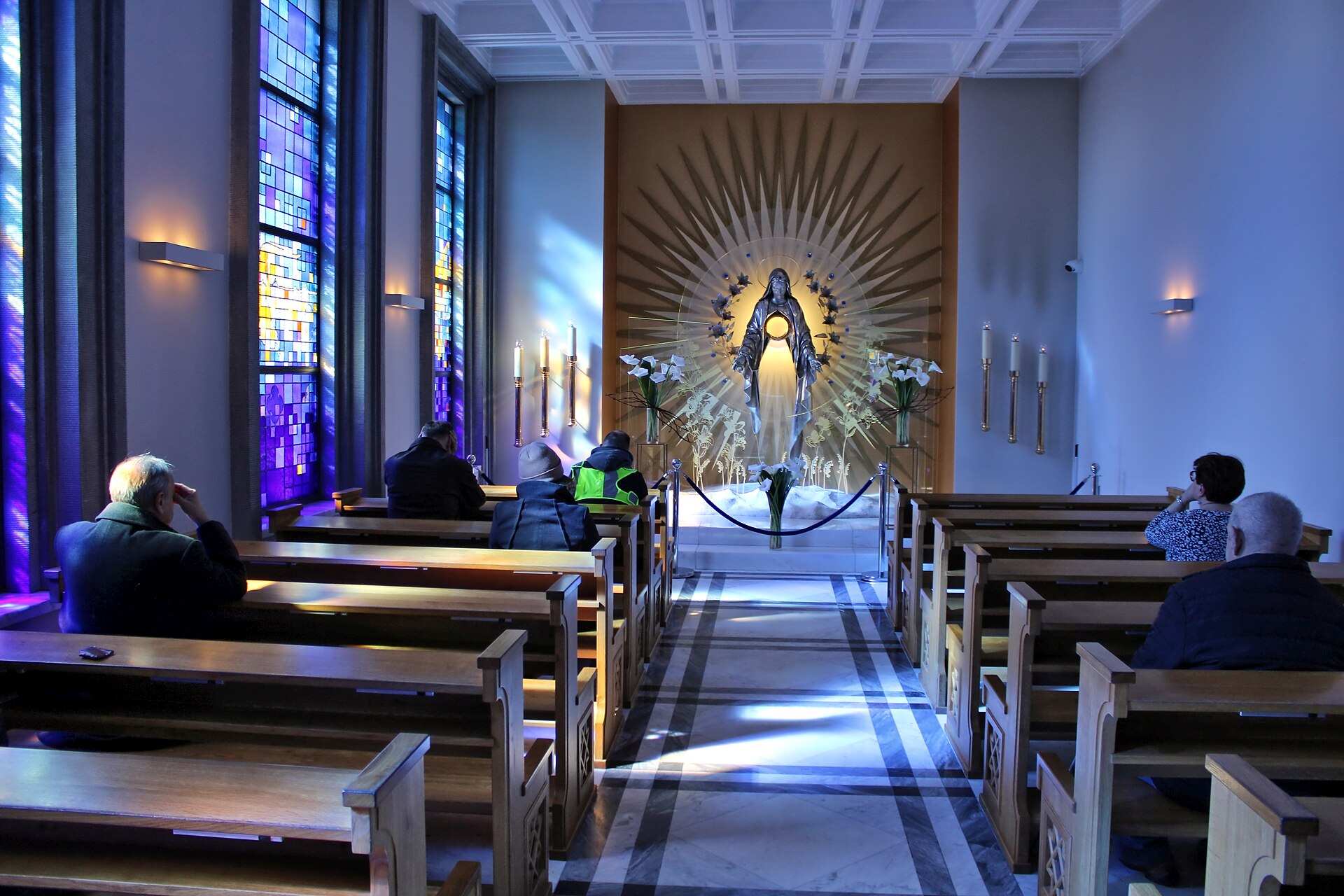 People praying in the Chapel of Perpetual Adoration in Niepokalanów